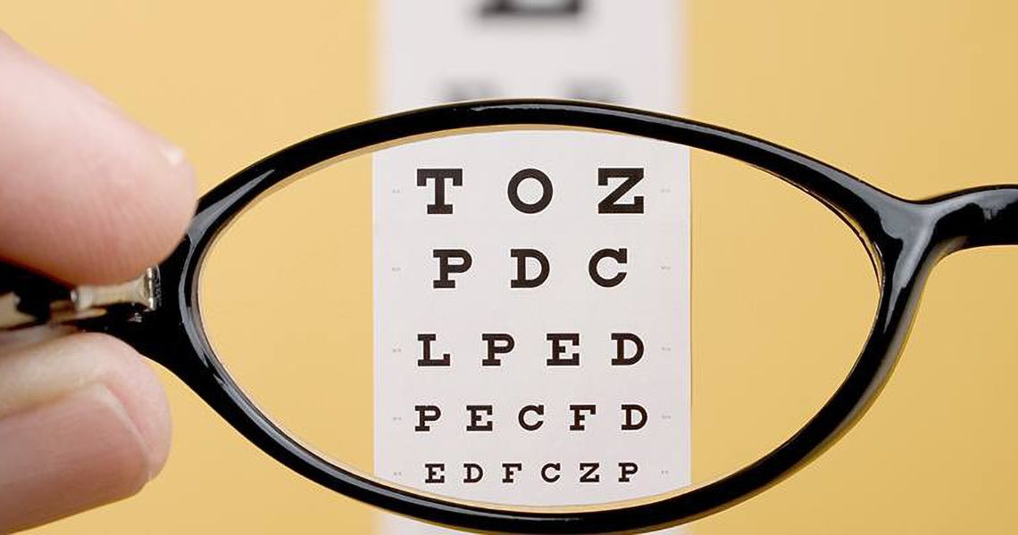 eye exam chart through an eyeglass lens