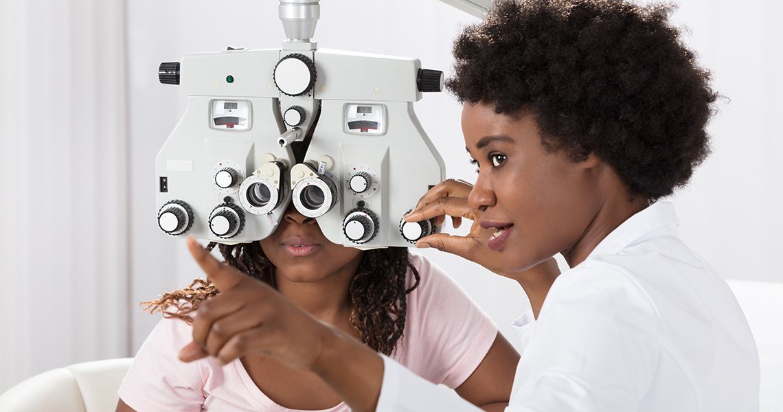 Ophthalmologist giving an eye exam