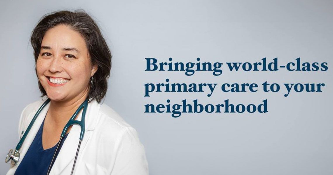 Physician smiling | "Bringing world-class primary care to your neighborhood"