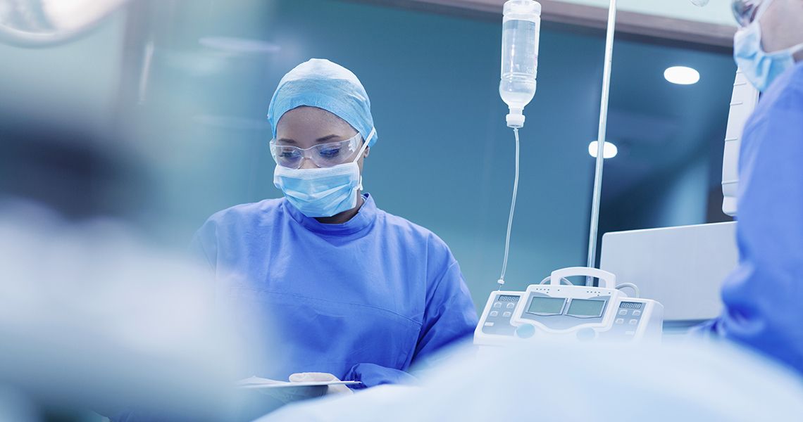 doctor in PPE in an operating room