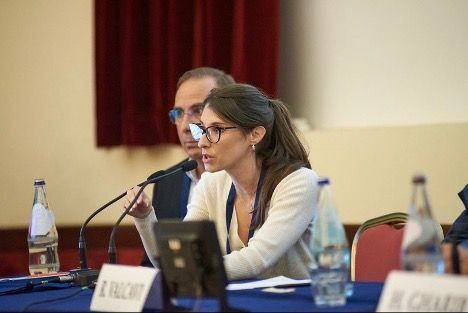 Dr. Baldwin speaking into a microphone