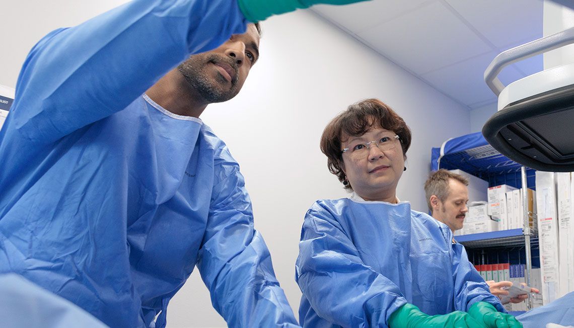 doctors in c-arm suite