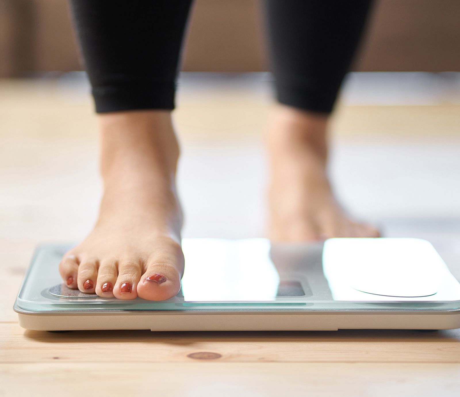 Person stepping on scale