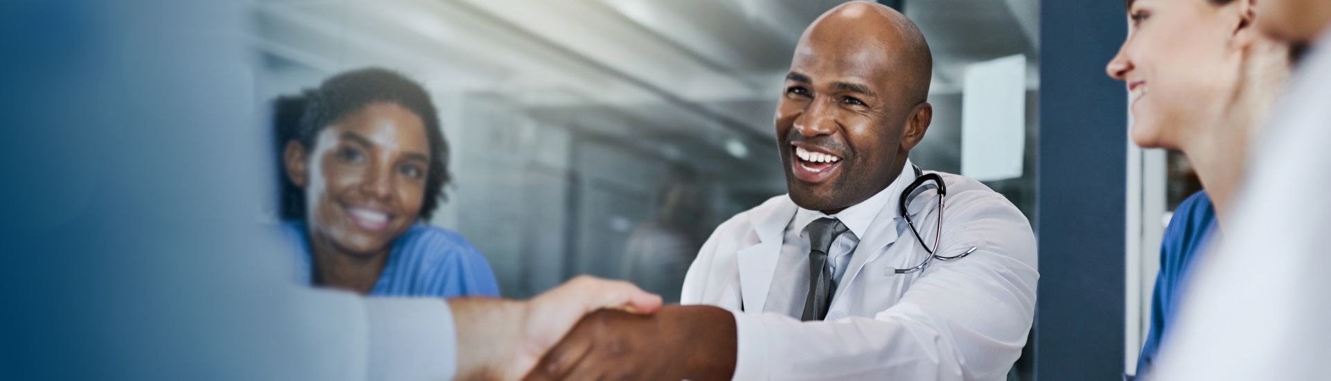 providers shaking hands with new hires