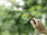 hand holding an air quality magnifying glass