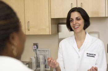 Jill Catalanotti, MD, speaks to a patient