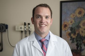 Zachary Zimmer, MD, smiles at the camera.